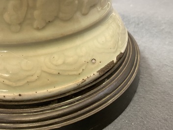 A Chinese blue and white on carved celadon-glazed ground vase, Kangxi